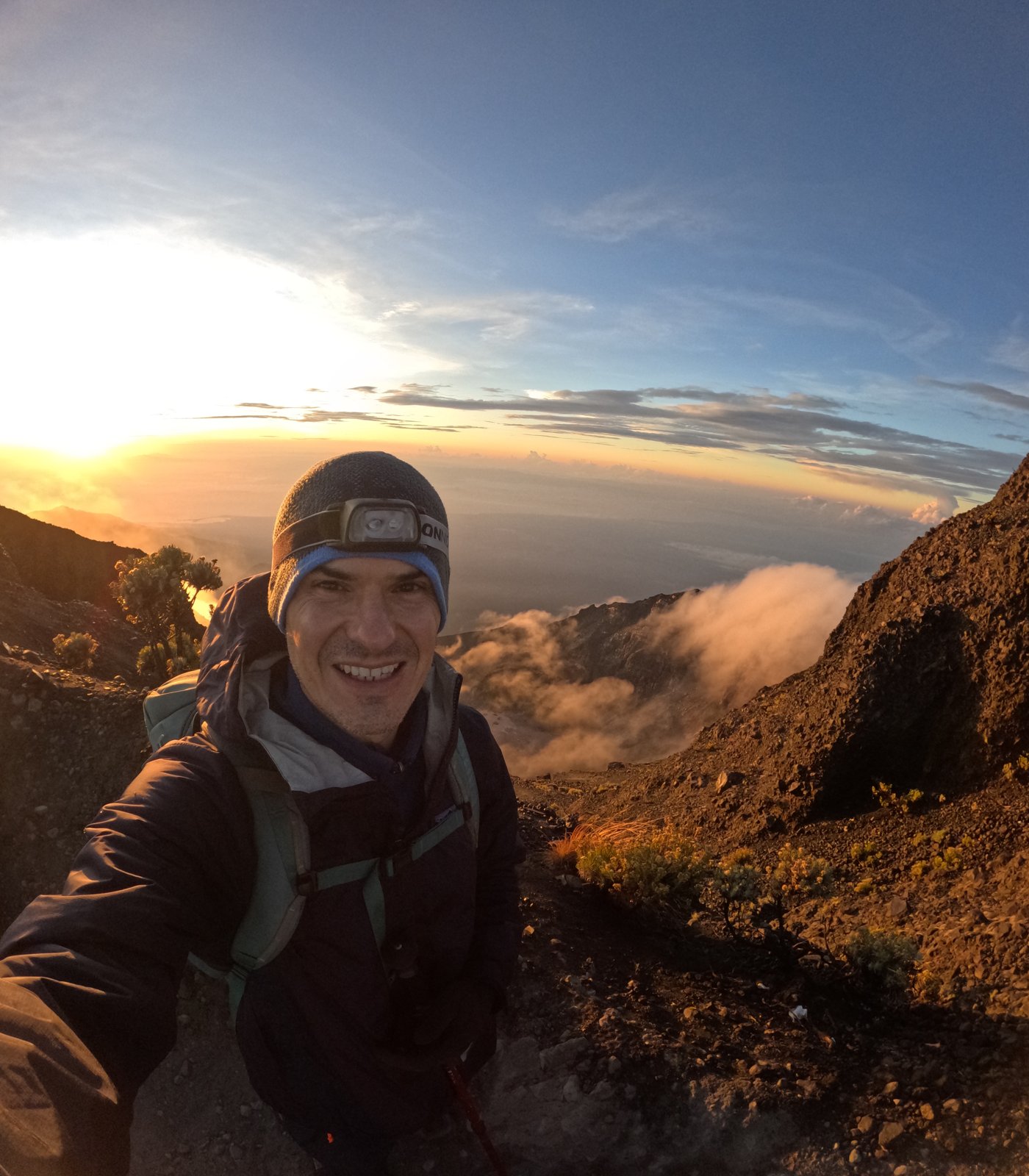 Luca Dal Zilio on a mountain summit at sunrise