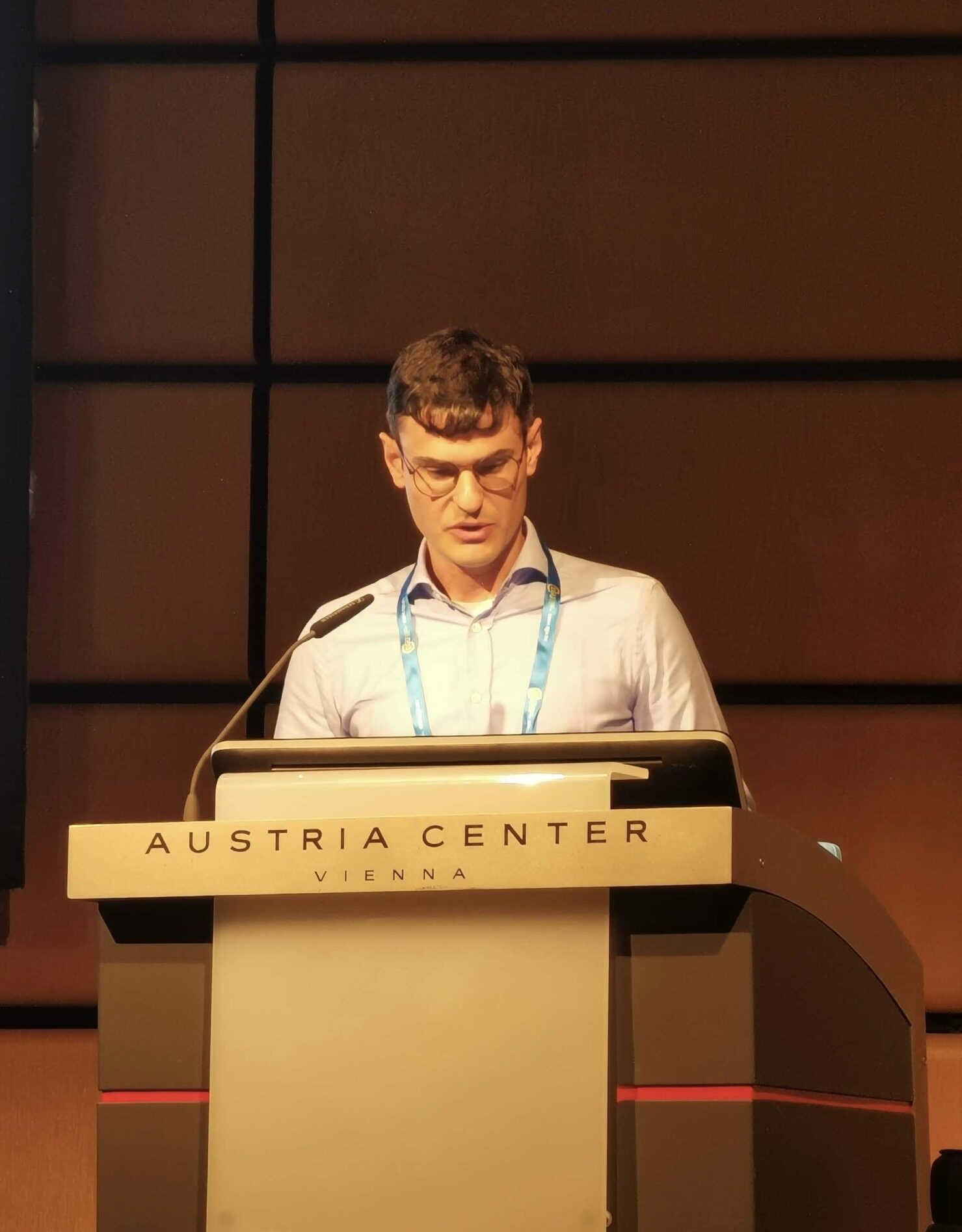 Luca Dal Zilio delivering a keynote in Vienna